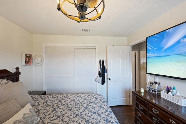 3983 Shay Dr, Bartow, FL 33830 - bedroom with a closet and dark wood-style floors