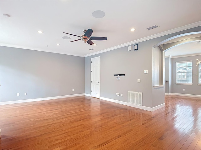 3111 W De Leon St Unit 2, Tampa, FL 33609 - unfurnished room with a ceiling fan, crown molding, arched walkways, recessed lighting, and light wood-style floors