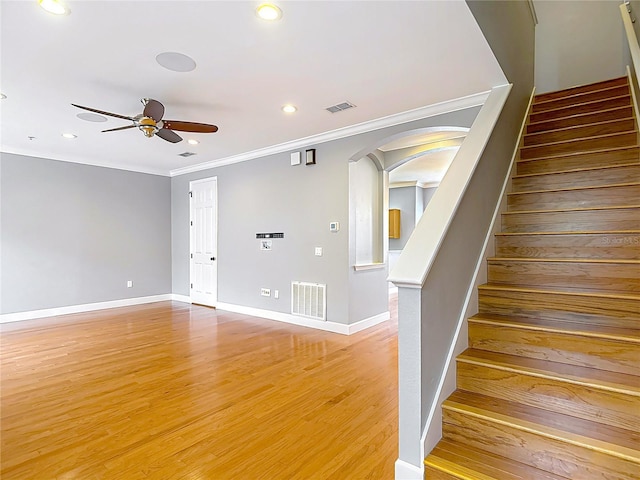 3111 W De Leon St Unit 2, Tampa, FL 33609 - stairs featuring arched walkways, ceiling fan, recessed lighting, crown molding, and wood finished floors