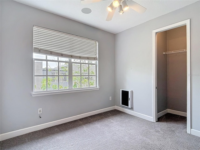 3111 W De Leon St Unit 2, Tampa, FL 33609 - unfurnished bedroom featuring carpet floors, a walk in closet, and baseboards