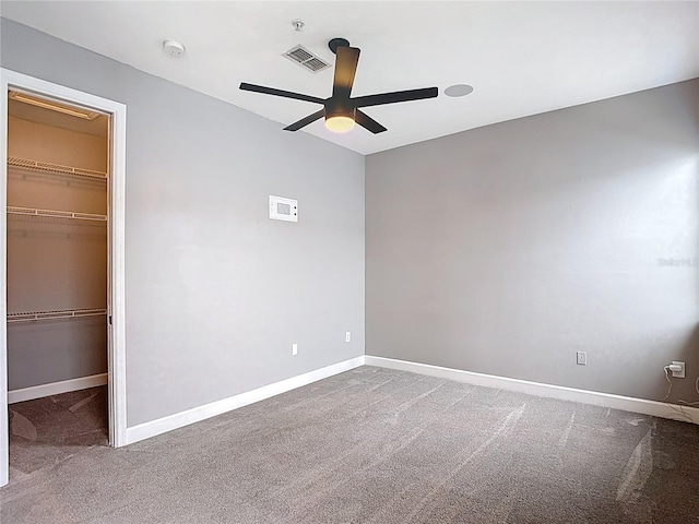 3111 W De Leon St Unit 2, Tampa, FL 33609 - unfurnished bedroom with a spacious closet, carpet floors, baseboards, and a closet