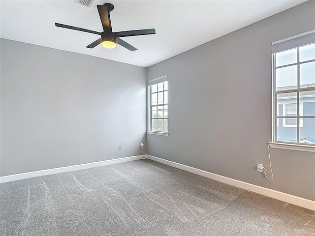 3111 W De Leon St Unit 2, Tampa, FL 33609 - empty room with ceiling fan, baseboards, and carpet floors