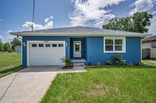 2307 N 47th St, Tampa, FL 33605 - view of front of house with concrete driveway, stucco siding, an attached garage, and a shingled roof