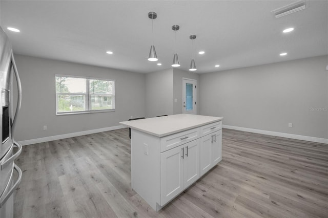 2307 N 47th St, Tampa, FL 33605 - kitchen with open floor plan, stainless steel refrigerator with ice dispenser, recessed lighting, white cabinets, and a kitchen island