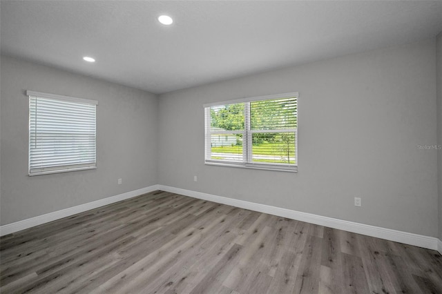 2307 N 47th St, Tampa, FL 33605 - unfurnished room with baseboards, wood finished floors, and recessed lighting