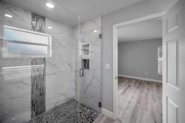 2307 N 47th St, Tampa, FL 33605 - bathroom with a marble finish shower, wood finished floors, recessed lighting, and baseboards