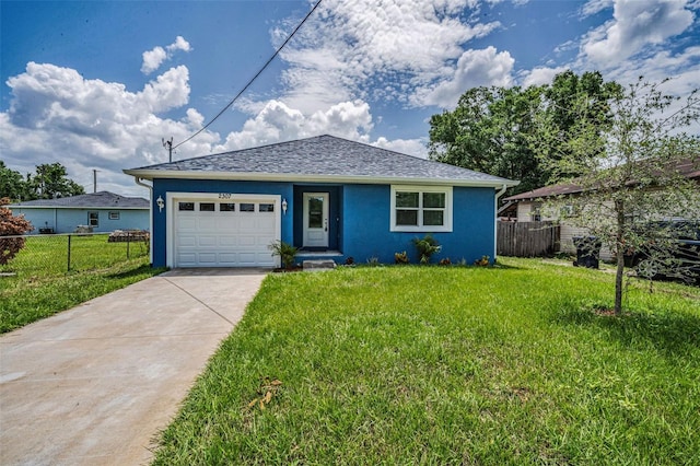 2307 N 47th St, Tampa, FL 33605 - view of front of house featuring an attached garage, stucco siding, driveway, and a shingled roof