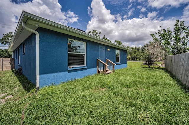 2307 N 47th St, Tampa, FL 33605 - rear view of property featuring stucco siding