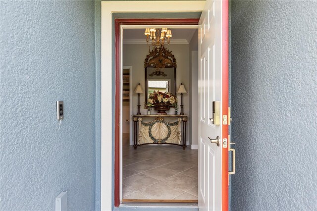16898 Balance Cv, Land O Lakes, FL 34638 - hallway with a chandelier
