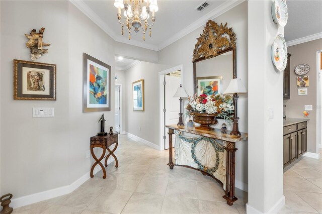 16898 Balance Cv, Land O Lakes, FL 34638 - entrance foyer featuring ornamental molding, a chandelier, baseboards, and light tile patterned flooring