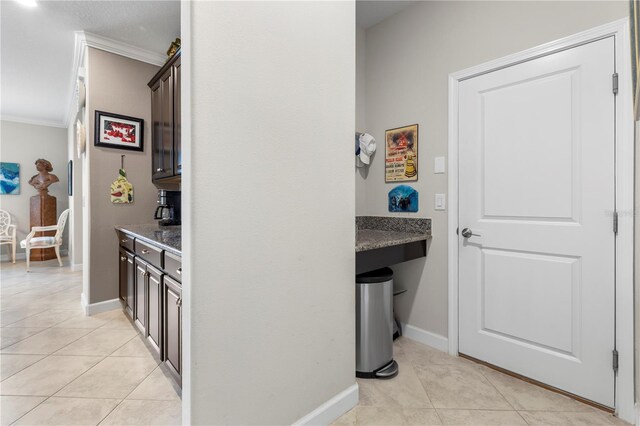 16898 Balance Cv, Land O Lakes, FL 34638 - hall with crown molding, light tile patterned floors, and baseboards