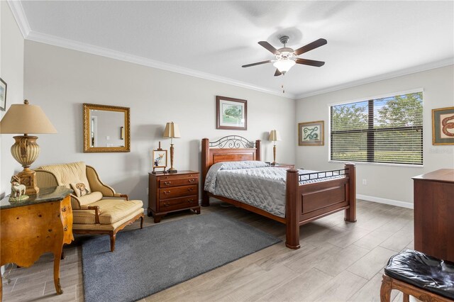 16898 Balance Cv, Land O Lakes, FL 34638 - bedroom featuring ornamental molding, baseboards, light wood-style floors, and a ceiling fan