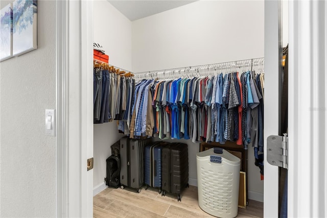16898 Balance Cv, Land O Lakes, FL 34638 - walk in closet featuring wood finish floors