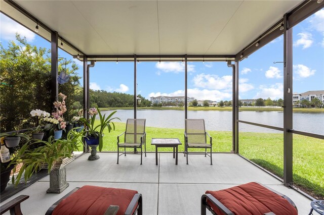 16898 Balance Cv, Land O Lakes, FL 34638 - sunroom / solarium with a water view and expansive windows