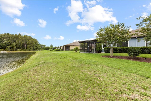 16898 Balance Cv, Land O Lakes, FL 34638 - view of grassy yard with a water view and a sunroom