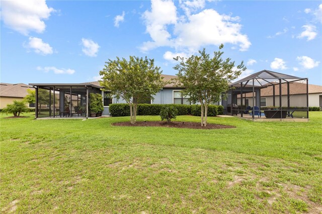 16898 Balance Cv, Land O Lakes, FL 34638 - back of house with a lawn and a lanai