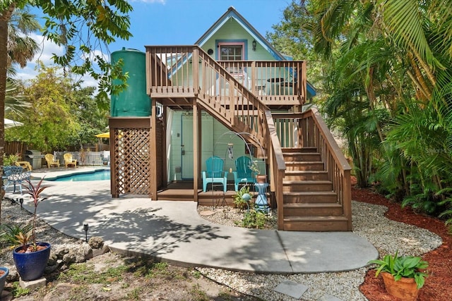 111 29th St W, Bradenton, FL 34205 - view of play area featuring a deck, stairs, and a patio area