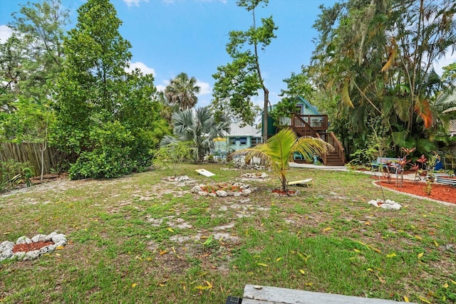 111 29th St W, Bradenton, FL 34205 - view of yard with a deck and stairs
