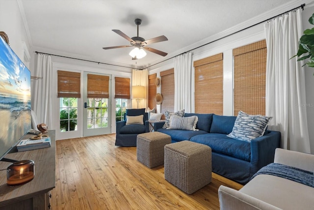 111 29th St W, Bradenton, FL 34205 - living room with ceiling fan, crown molding, and light wood-style flooring