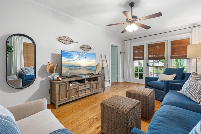 111 29th St W, Bradenton, FL 34205 - living room with ornamental molding, light wood-style flooring, and a ceiling fan