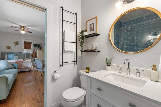 111 29th St W, Bradenton, FL 34205 - ensuite bathroom with vanity, ceiling fan, wood-type flooring, and a shower