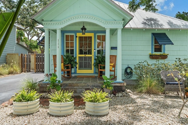 111 29th St W, Bradenton, FL 34205 - property entrance with a porch and a metal roof