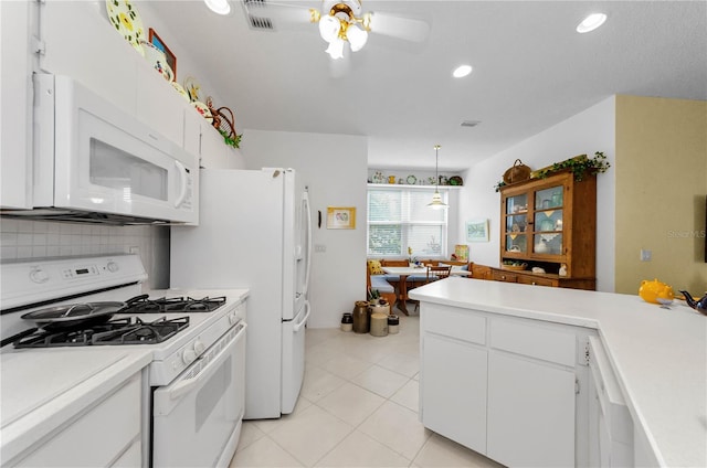 1051 Glynwood Pl, Dunedin, FL 34698 - kitchen featuring white appliances, a ceiling fan, light countertops, white cabinets, and recessed lighting
