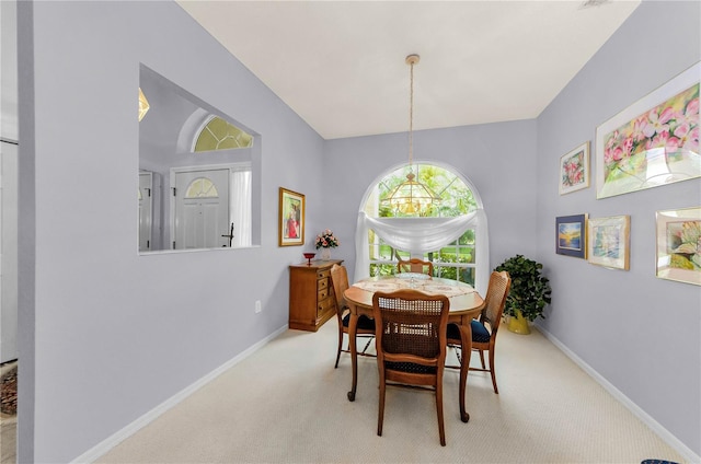 1051 Glynwood Pl, Dunedin, FL 34698 - dining space with carpet flooring and baseboards