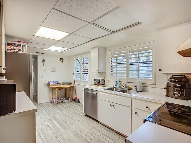 6901 Arbor Oaks Ct, Bradenton, FL 34209 - kitchen featuring dishwasher, a sink, healthy amount of natural light, and light countertops