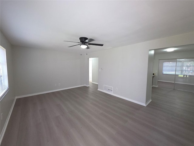 2045 Summit Dr, Dunedin, FL 34698 - spare room featuring ceiling fan, dark wood-style floors, and baseboards