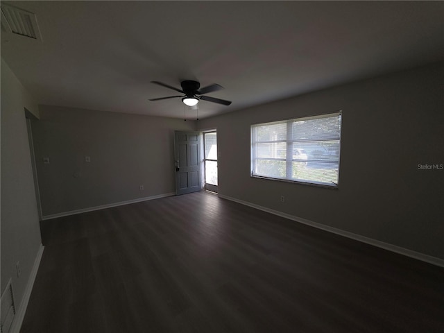 2045 Summit Dr, Dunedin, FL 34698 - spare room featuring a ceiling fan, dark wood-type flooring, and baseboards