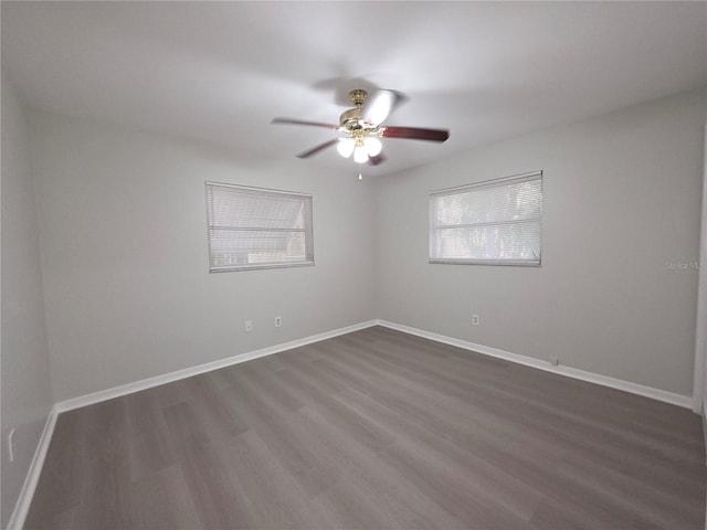 2045 Summit Dr, Dunedin, FL 34698 - spare room featuring dark wood finished floors, a ceiling fan, and baseboards