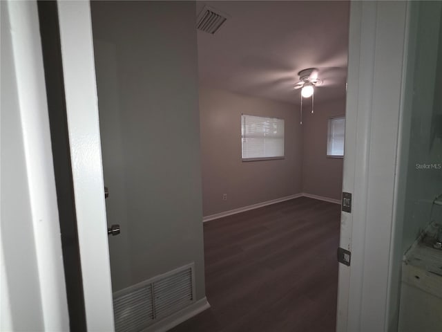 2045 Summit Dr, Dunedin, FL 34698 - empty room featuring dark wood-style floors, ceiling fan, and baseboards