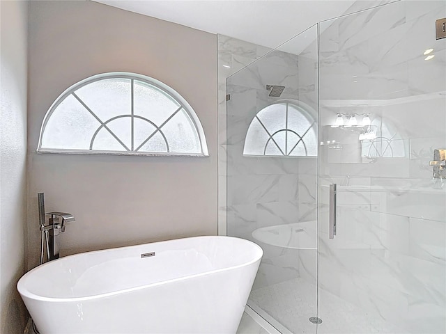 5809 Silas Creek Ln, Wesley Chapel, FL 33545 - bathroom with a freestanding tub and a marble finish shower