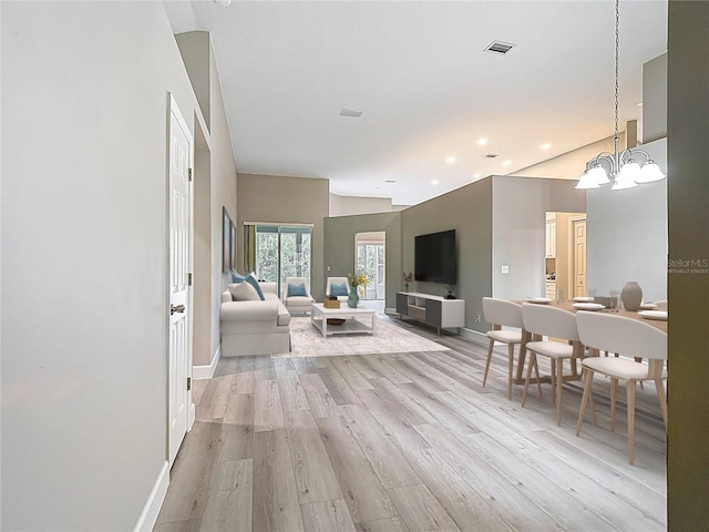 5809 Silas Creek Ln, Wesley Chapel, FL 33545 - living room featuring light wood-type flooring, a chandelier, and recessed lighting