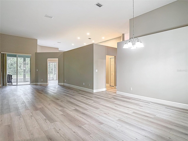 5809 Silas Creek Ln, Wesley Chapel, FL 33545 - spare room with a chandelier, light wood-type flooring, recessed lighting, and high vaulted ceiling