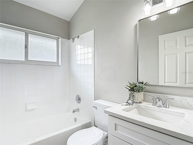 5809 Silas Creek Ln, Wesley Chapel, FL 33545 - full bathroom featuring vanity, a textured wall, and  shower combination