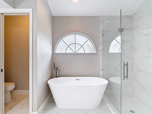 5809 Silas Creek Ln, Wesley Chapel, FL 33545 - bathroom featuring marble finish floors, a marble finish shower, and a soaking tub