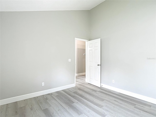 5809 Silas Creek Ln, Wesley Chapel, FL 33545 - unfurnished room featuring light wood finished floors and high vaulted ceiling