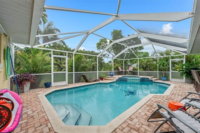 2812 SW 29th Ave, Cape Coral, FL 33914 - view of swimming pool with a patio area, a pool with connected hot tub, and glass enclosure