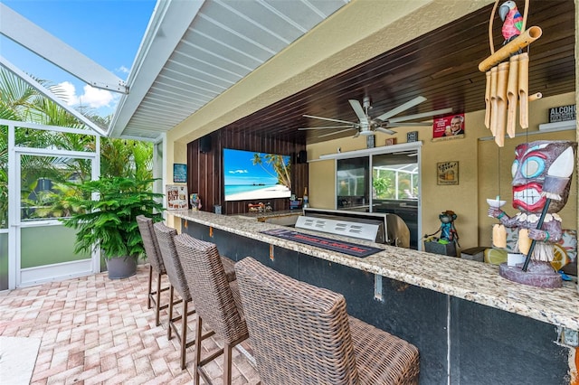 2812 SW 29th Ave, Cape Coral, FL 33914 - view of patio with an outdoor kitchen, a lanai, and ceiling fan
