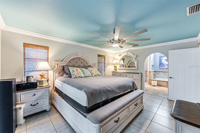 2812 SW 29th Ave, Cape Coral, FL 33914 - bedroom featuring light tile patterned flooring, crown molding, arched walkways, and ceiling fan
