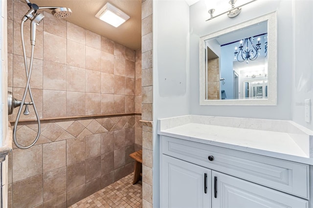 2812 SW 29th Ave, Cape Coral, FL 33914 - full bathroom featuring vanity, a tile shower, and a chandelier