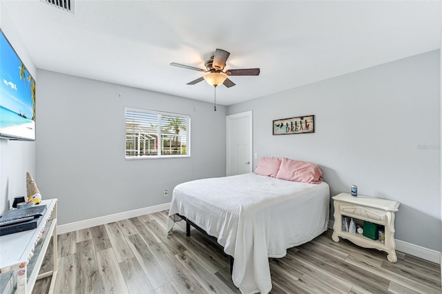 2812 SW 29th Ave, Cape Coral, FL 33914 - bedroom featuring light wood-style floors, baseboards, and a ceiling fan