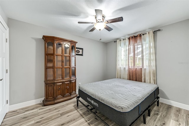 2812 SW 29th Ave, Cape Coral, FL 33914 - bedroom featuring light wood finished floors, baseboards, and a ceiling fan