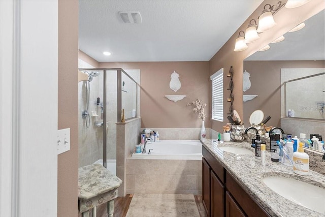 12026 Crestridge Loop, New Port Richey, FL 34655 - bathroom with a garden tub, a stall shower, and double vanity