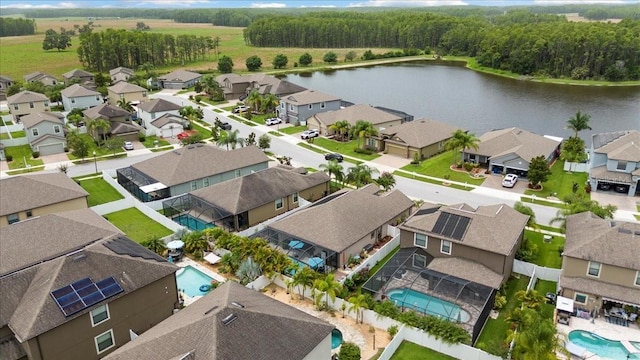 12026 Crestridge Loop, New Port Richey, FL 34655 - aerial view of residential area with a nearby body of water and a pool area