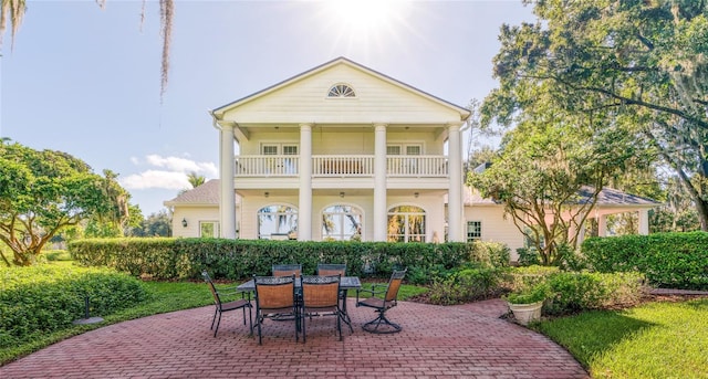 15612 Howell Park Ln, Tampa, FL 33625 - back of house with a patio area, outdoor dining area, and a balcony