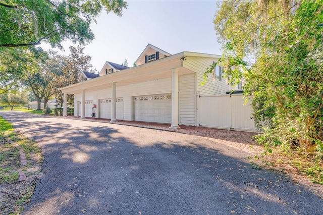 15612 Howell Park Ln, Tampa, FL 33625 - garage featuring asphalt driveway