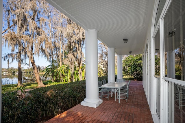 15612 Howell Park Ln, Tampa, FL 33625 - view of patio featuring a water view and outdoor dining area